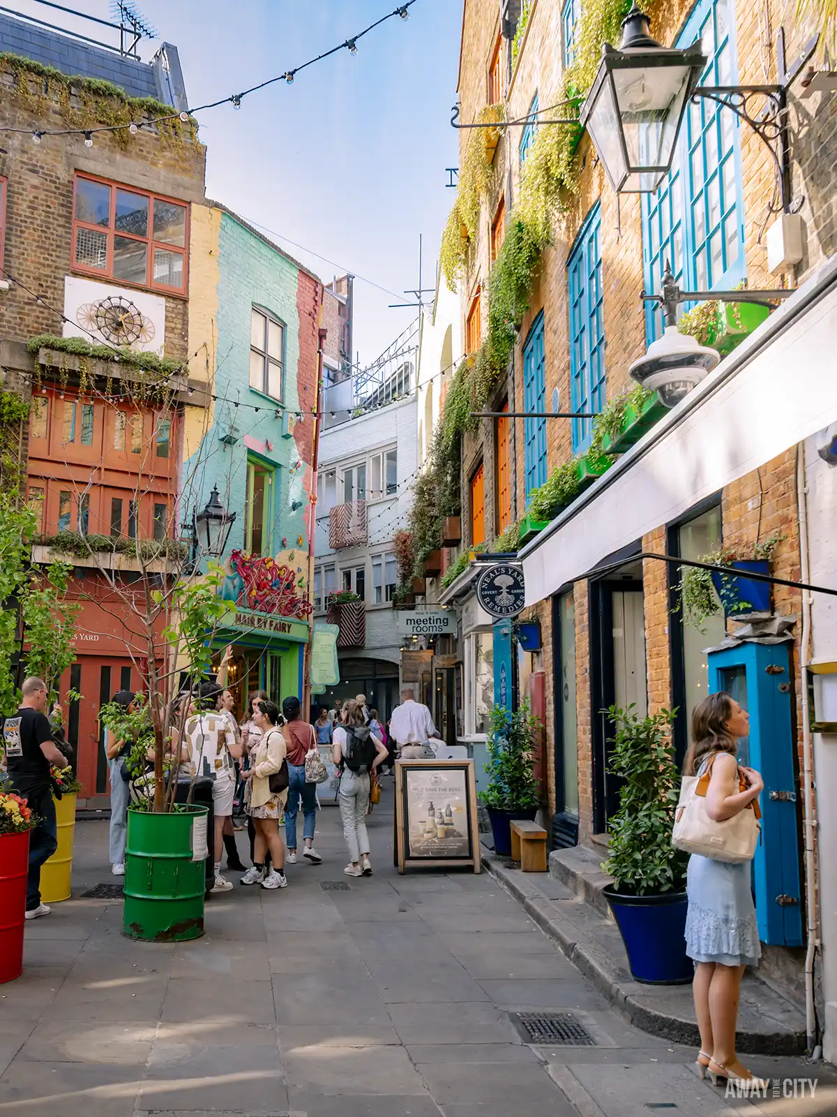 A glimpse of Neal's Yard in Seven Dials, London, known for its picturesque courtyard and colourful buildings.