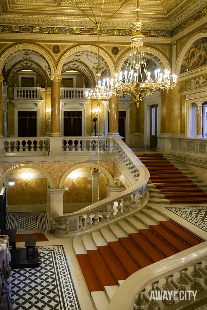 The grand staircase during a guided tour of the Hungarian State Opera House in Budapest, one of the best things to do on a Budapest city break.