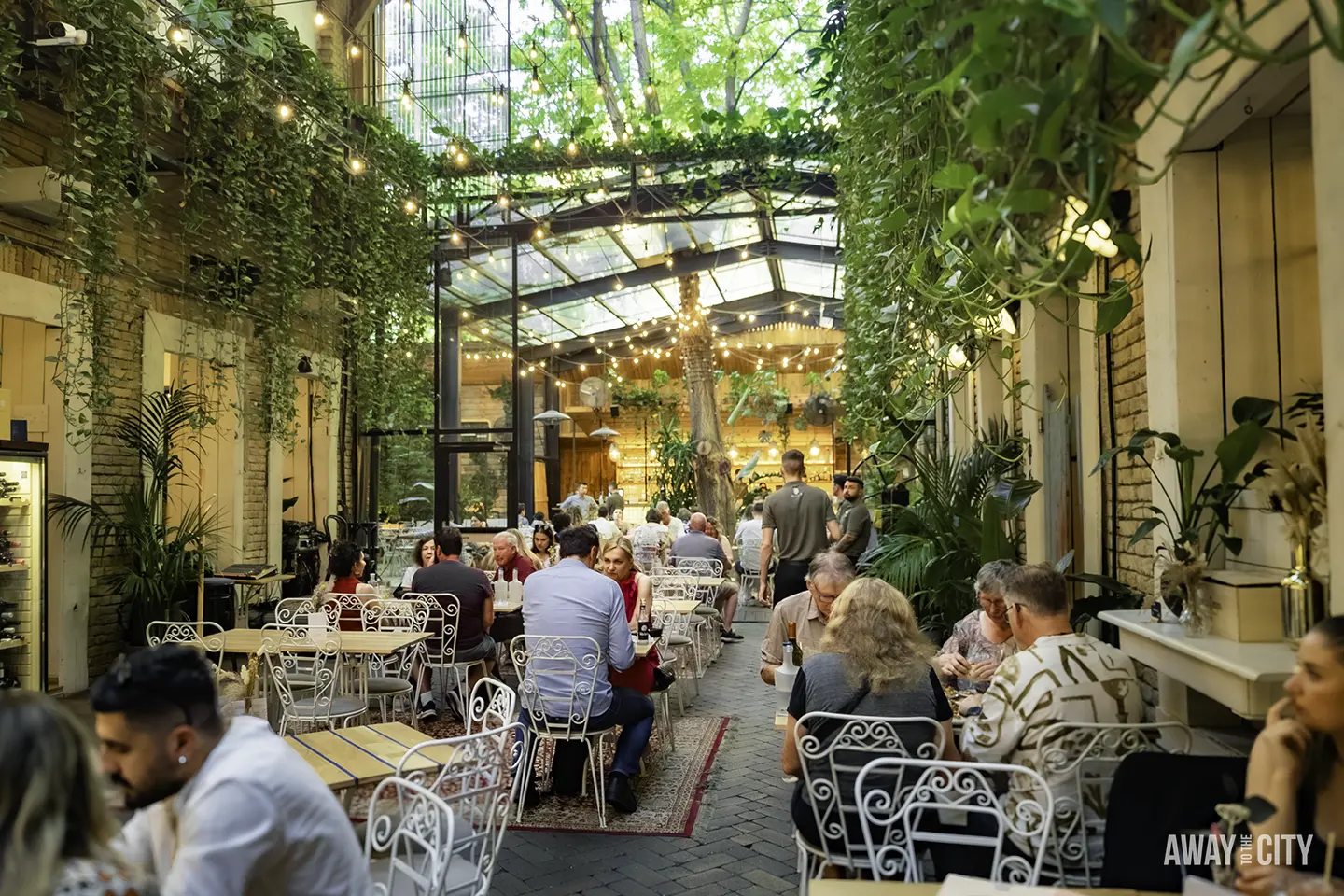 An interior view of the Mazel Tov ruin bar in Budapest, one of the best things to do on a Budapest city break.