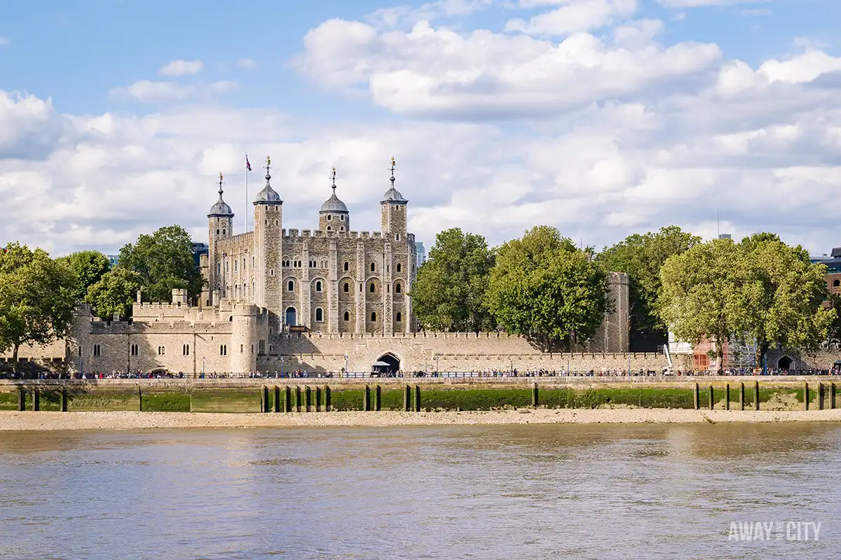 A view from the river of the historic Tower of London, a medieval castle and fortress on the banks of the River Thames.