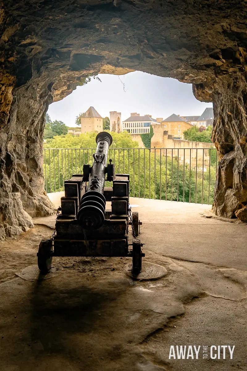 A picture of a person standing in a stone archway at the Bock Casemates in Luxembourg City