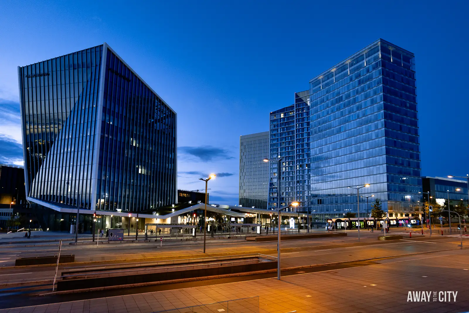 A picture of several tall buildings in the modern district of Kirchberg in Luxembourg City, captured during the Blue Hour