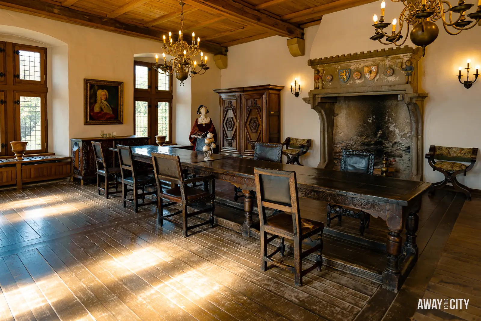 A picture of a large table and chairs in the dining hall inside Vianden Castle in Luxembourg