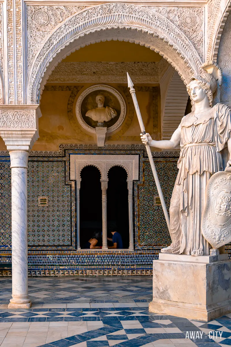 A statue in the courtyard of Casa de Pilatos, one of the best things to do in Seville, Spain.