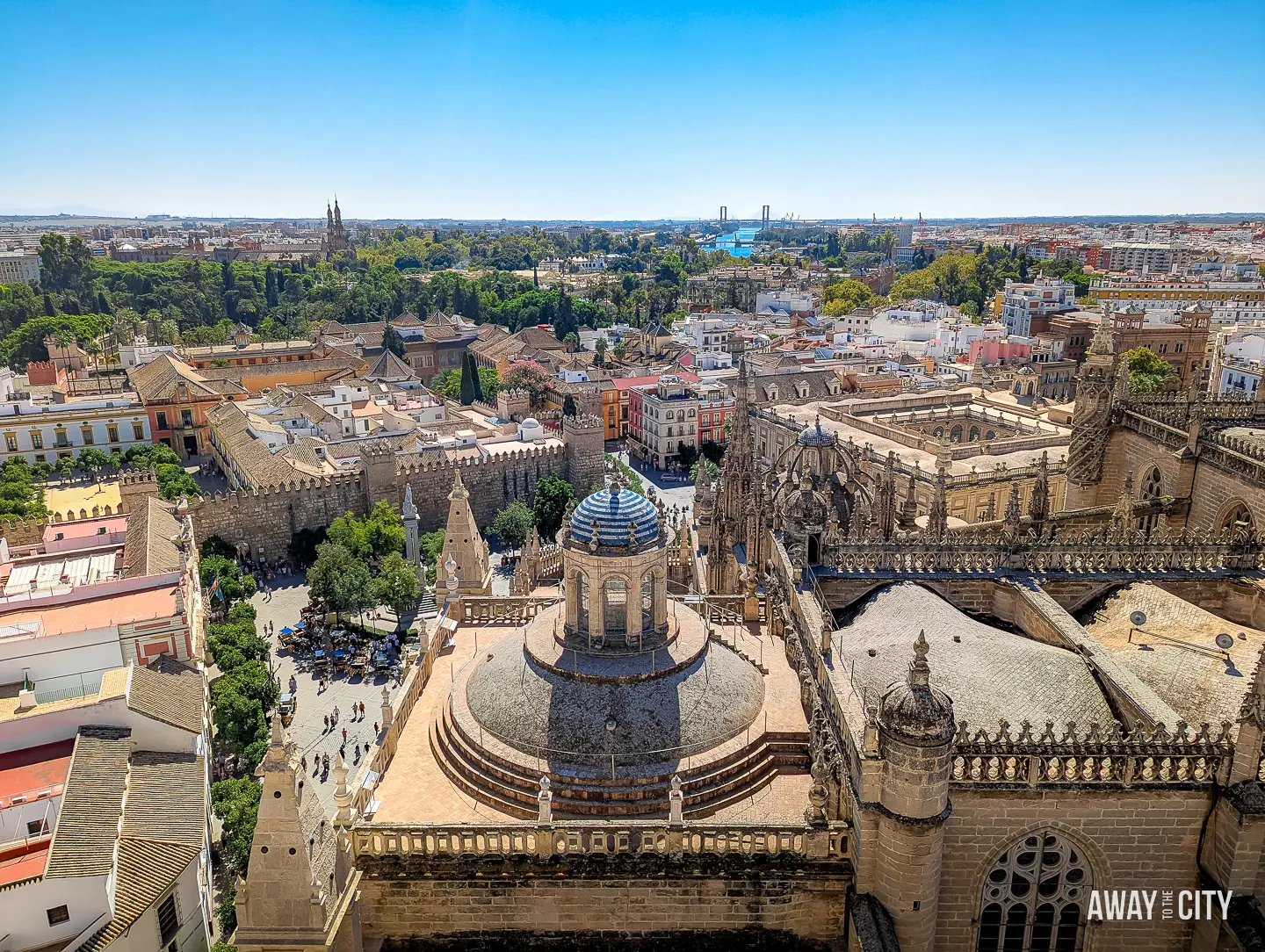 A panoramic view of Seville Cathedral and Seville's cityscape from La Giralda Bell Tower.