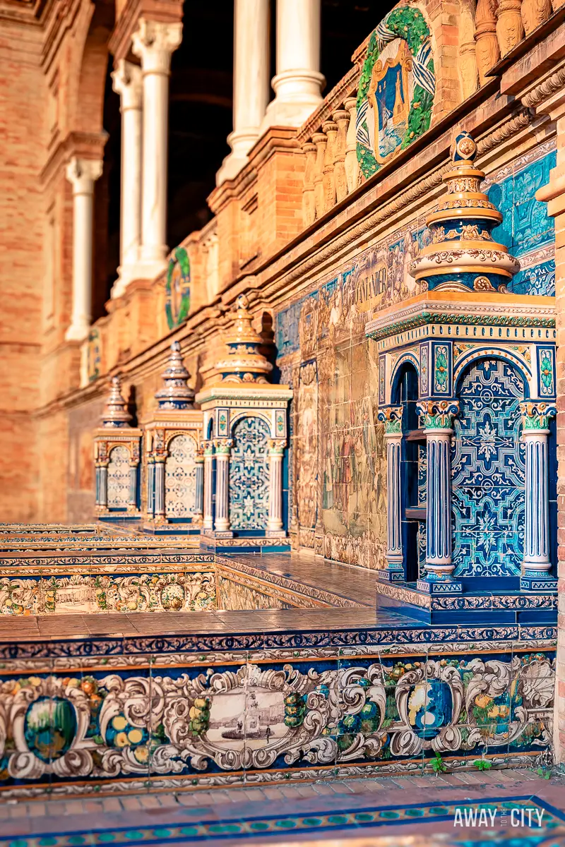 A picture of the intricate and colourful azulejos (tiles) at Plaza de España in Seville (Spain), showing its famous ceramic decoration.