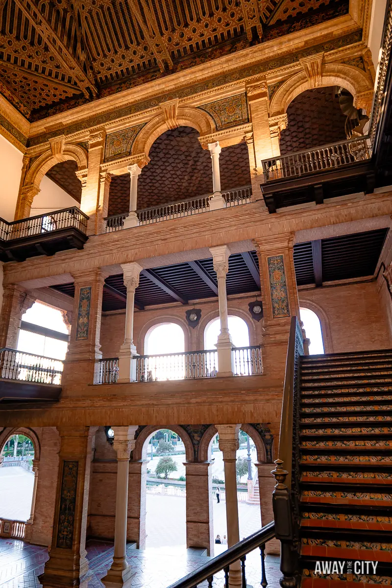 A picture of one of the interior staircase halls inside Plaza de España in Seville.