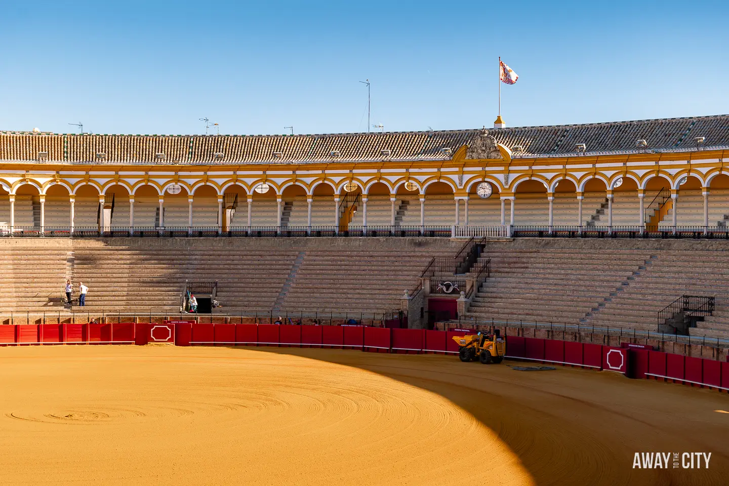 A picture of the historic bullfighting ring seen at a tour of the arena at Plaza de Toros Real Maestranza in Seville, Spain.