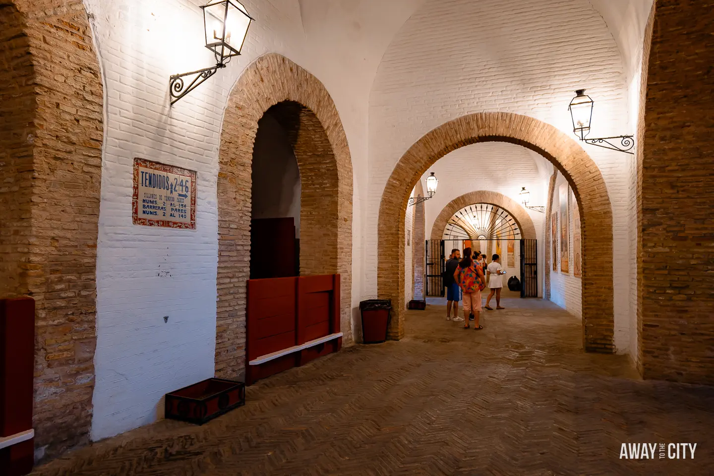 A picture of the hallway leading to different sections of Plaza de Toros Real Maestranza in Seville, connecting the visitors to various parts of the bullring.