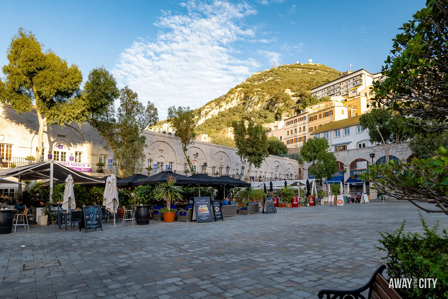 A picture of Casemates Square in Gibraltar and the Gibraltar Rock in the background.