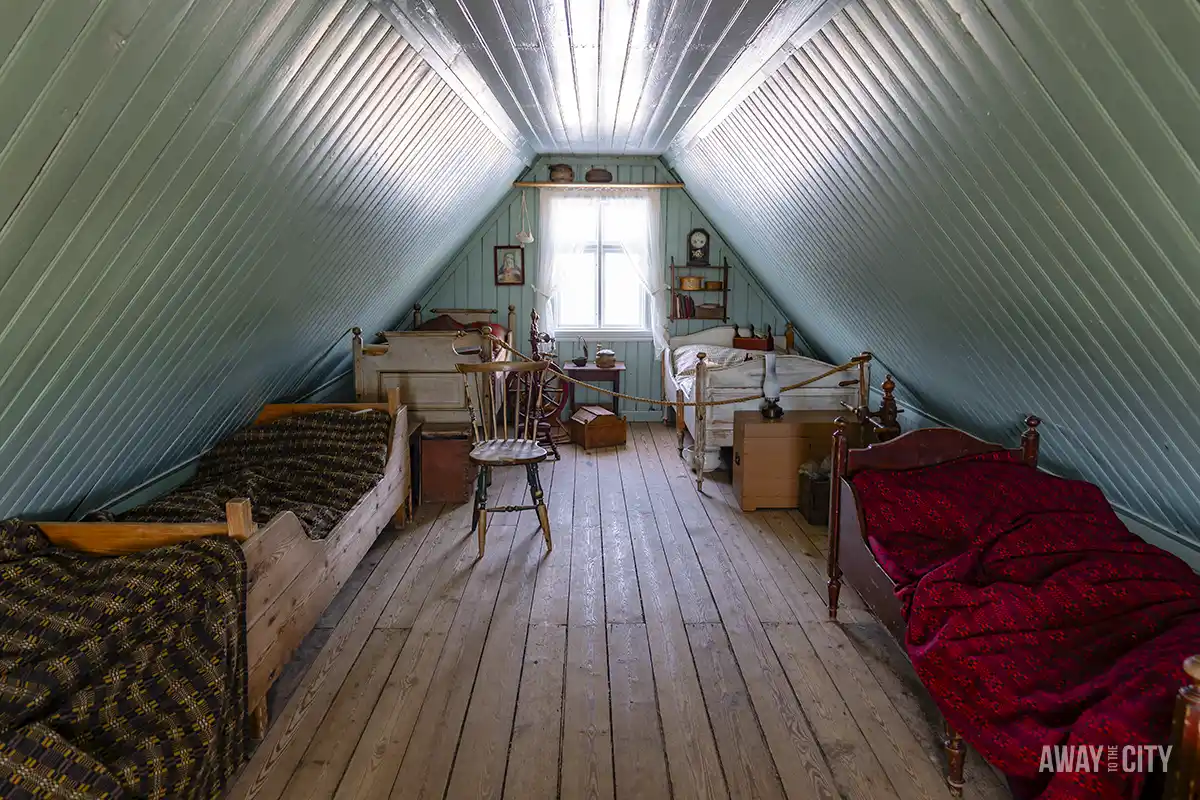 An old room with several beds in an old farmhouse of Arbaer, taken at the Arbaer Open Air Folk Museum in Reykjavik, which is one of the best things to do in Reykjavik in winter.