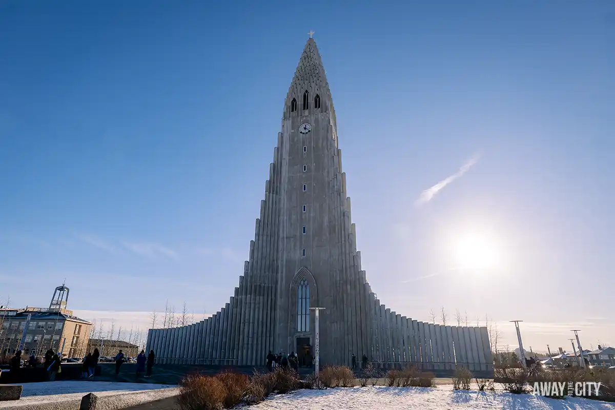 The Hallgrímskirkja church in Reykjavik is captured against a clear sky, showcasing its unique and towering architecture.
