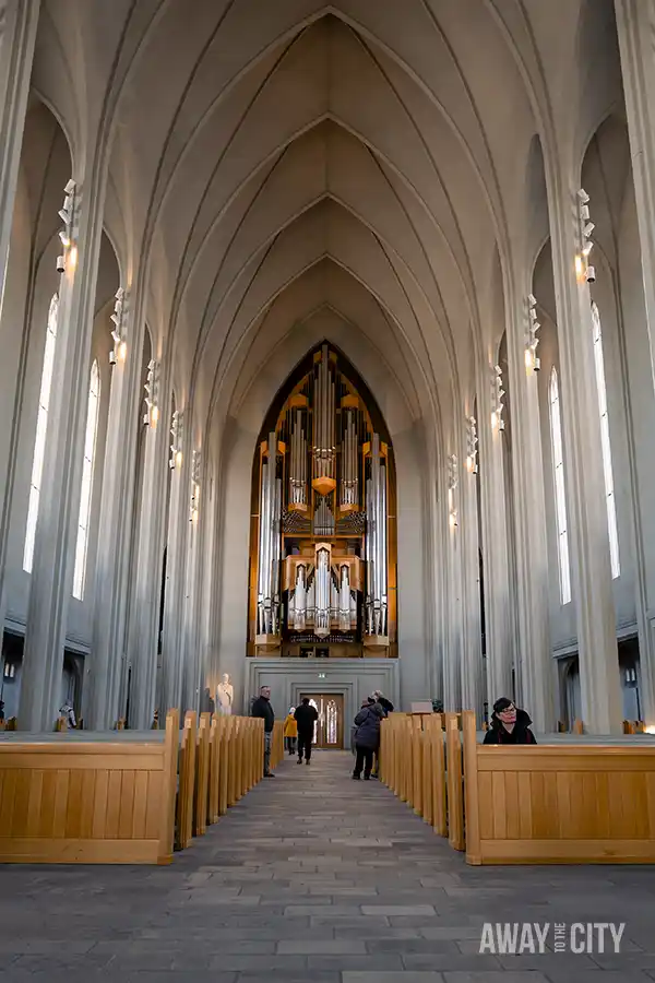 A church from the inside with many columns and a pipe organ, taken at Hallgrímskirkja in Reykjavik.