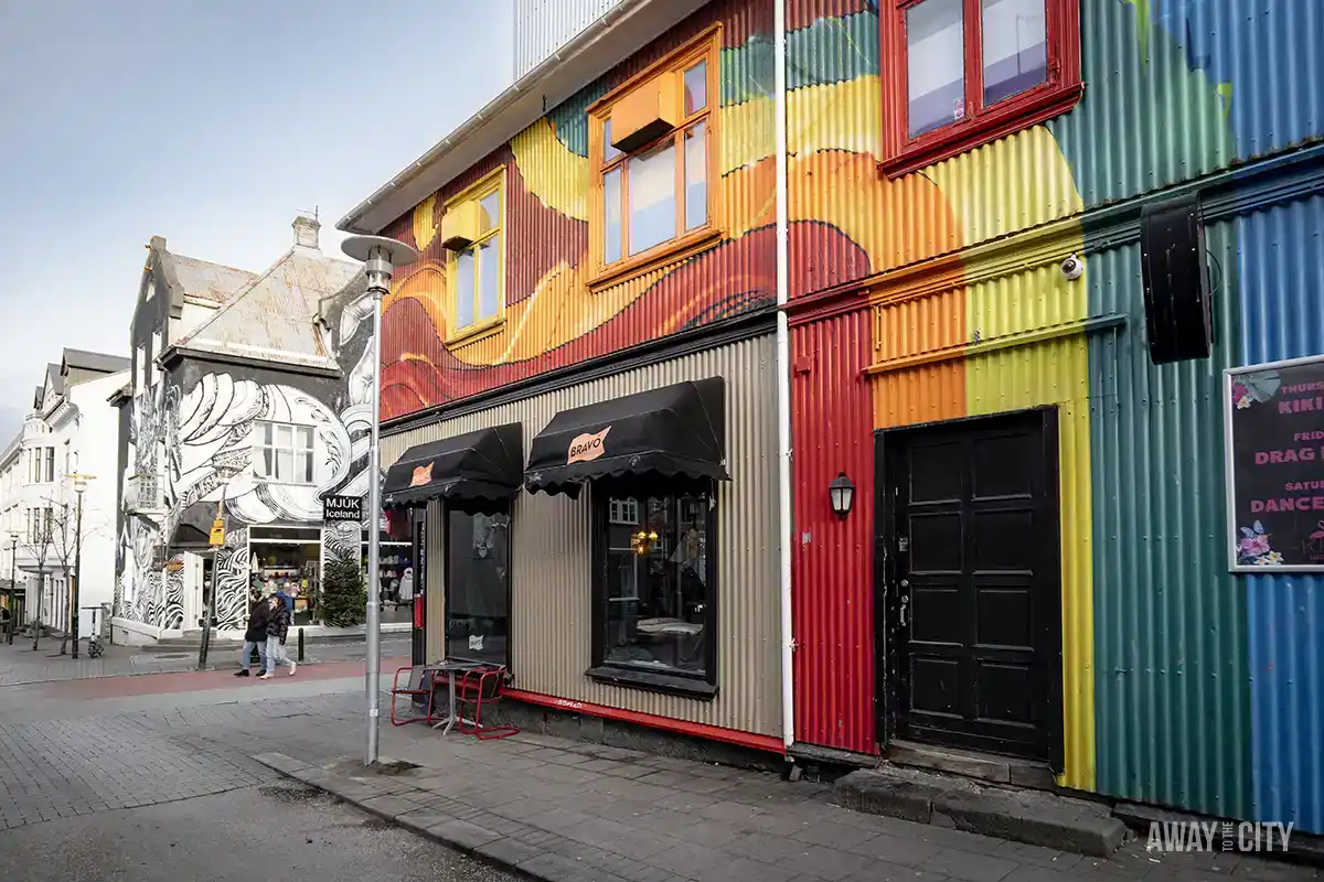 A colourful building with a rainbow painted on the side at Laugavegur, Reykjavík’s main shopping street and one of the oldest in the city.