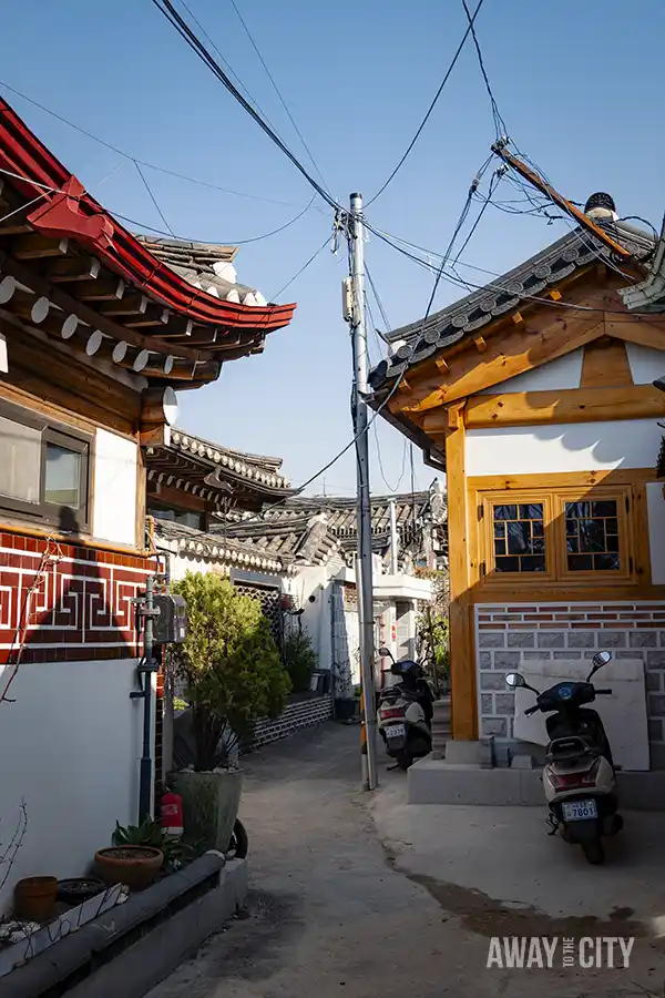 A street with buildings and power lines at Bukchon Hanok Village, a residential neighbourhood in the Jongno District in Seoul, South Korea.
