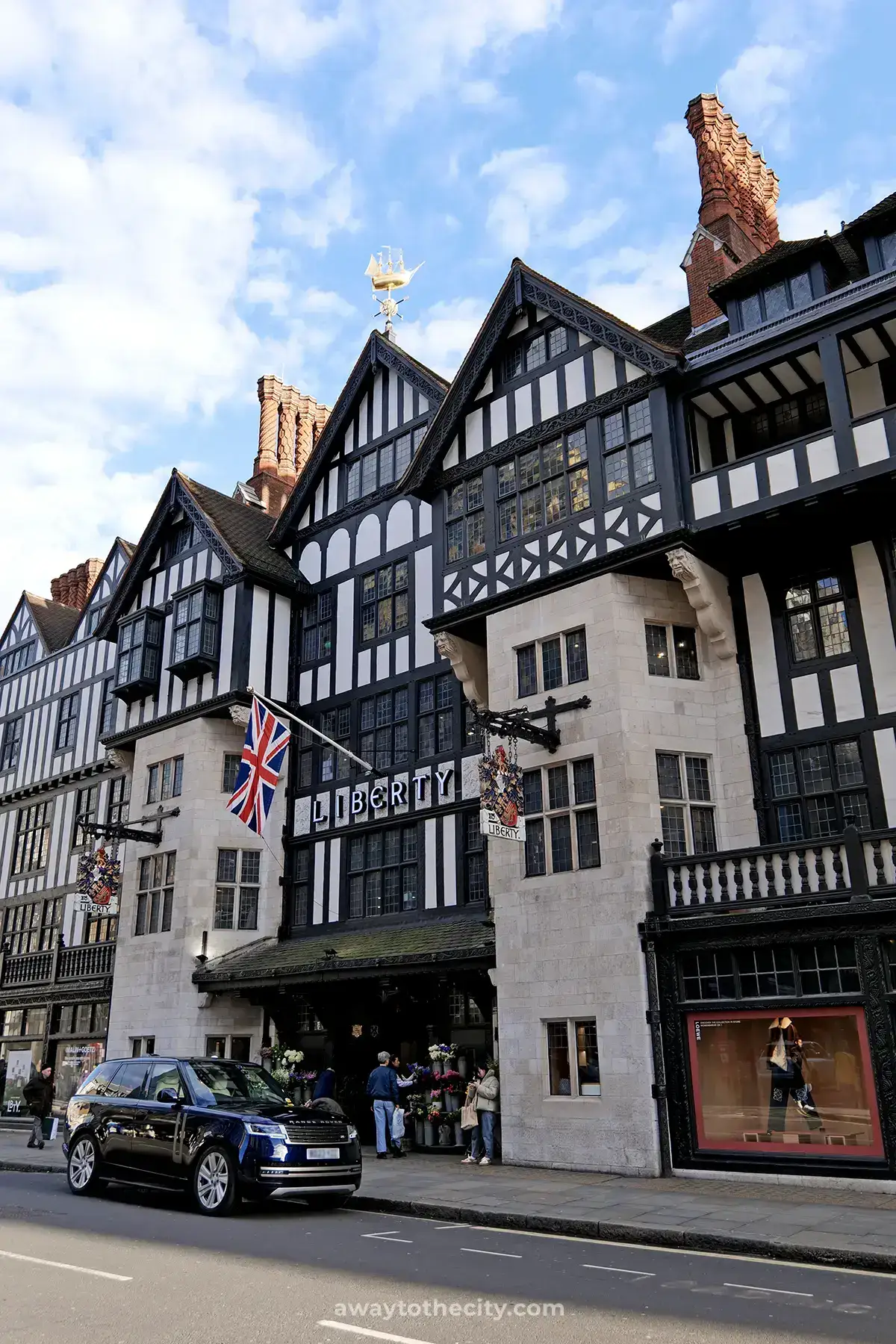 The iconic Tudor-style facade of Liberty London is captured from street level, a prime example of what to do in Soho for architectural sightseeing.