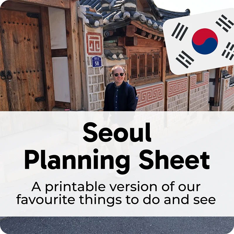 Man standing in traditional Seoul street with South Korean flag icon and overlay text 'Seoul Planning Sheet' and 'A printable version of our favourite things to do and see'.