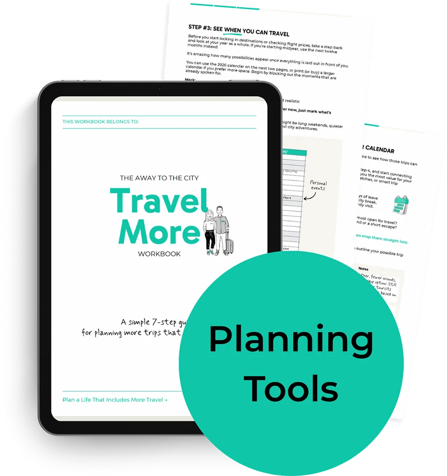 Tablet showing The Away To The City Travel More Workbook with pages behind and green circle overlay text reading “Planning Tools”.