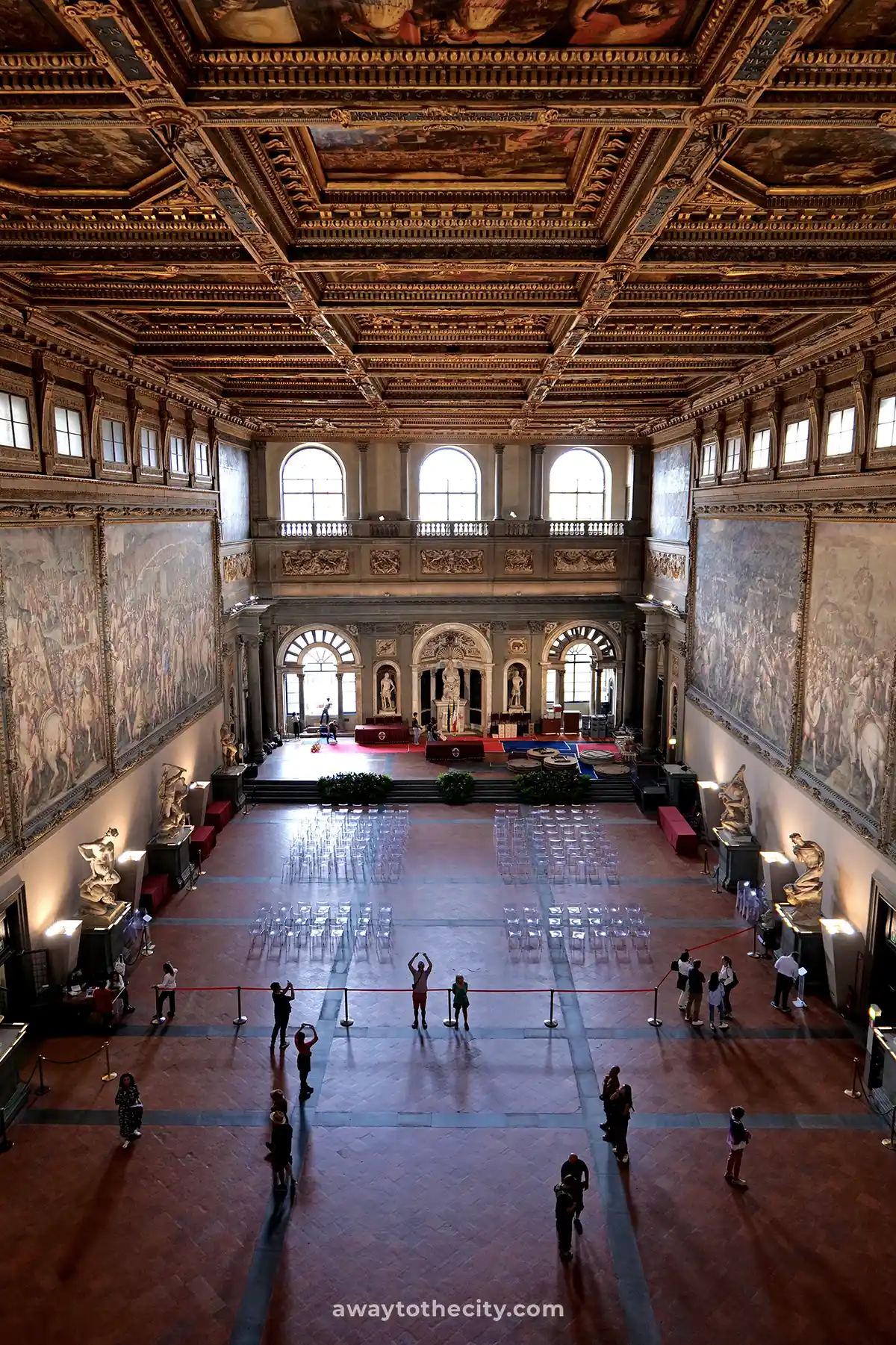 The magnificent, ornately decorated Salone dei Cinquecento within Palazzo Vecchio showcases a grand hall filled with historical artwork, a key attraction during a 2-day Florence itinerary.