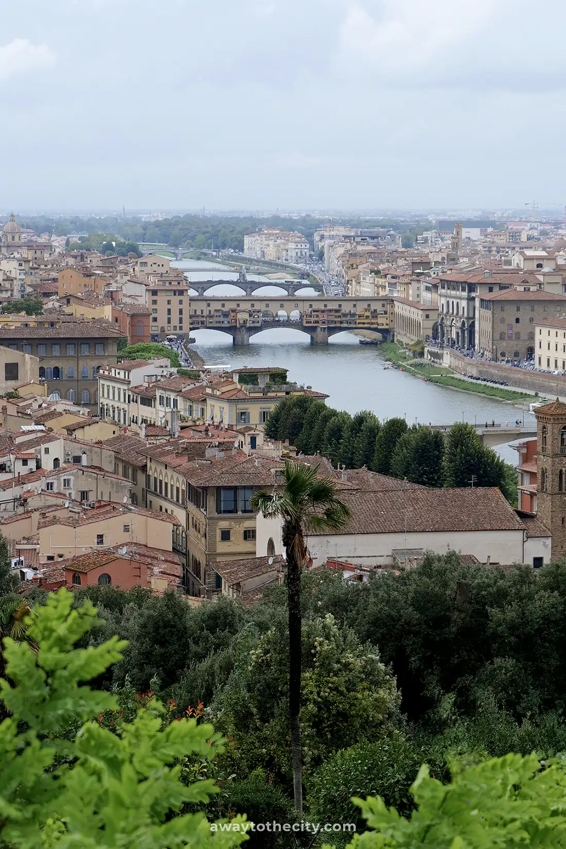 From Piazzale Michelangelo, the iconic Ponte Vecchio spans the Arno River in Florence.
