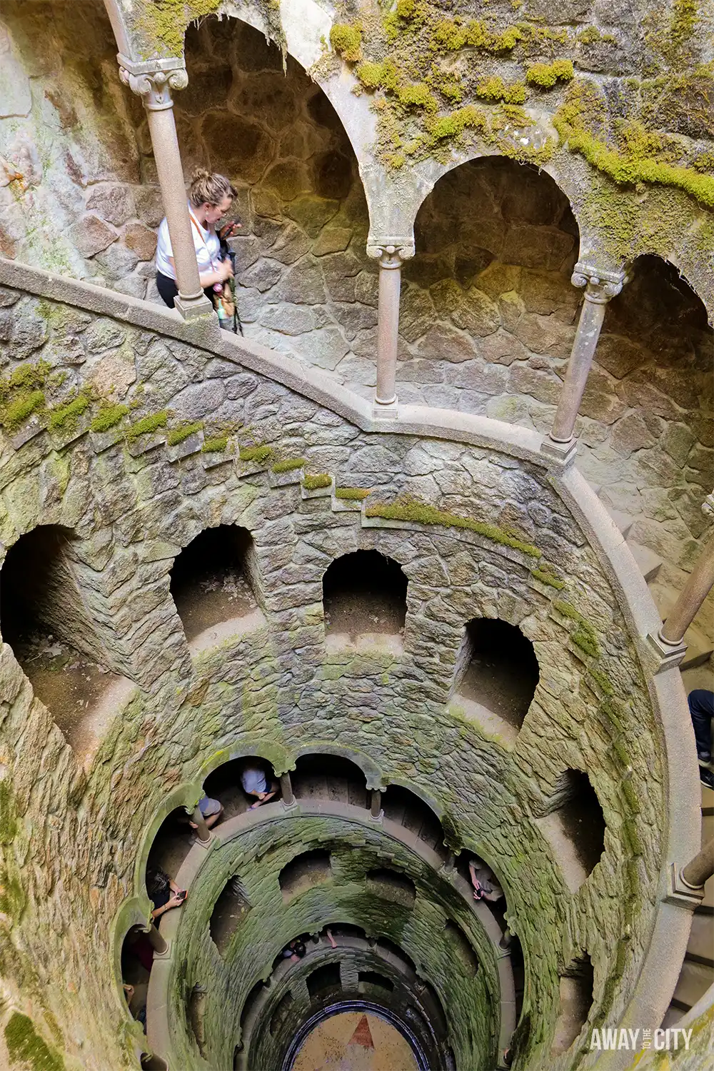 The Initiation Well at Quinta da Regaleira in Sintra, showing the famous inverted tower with spiralling stone staircase.