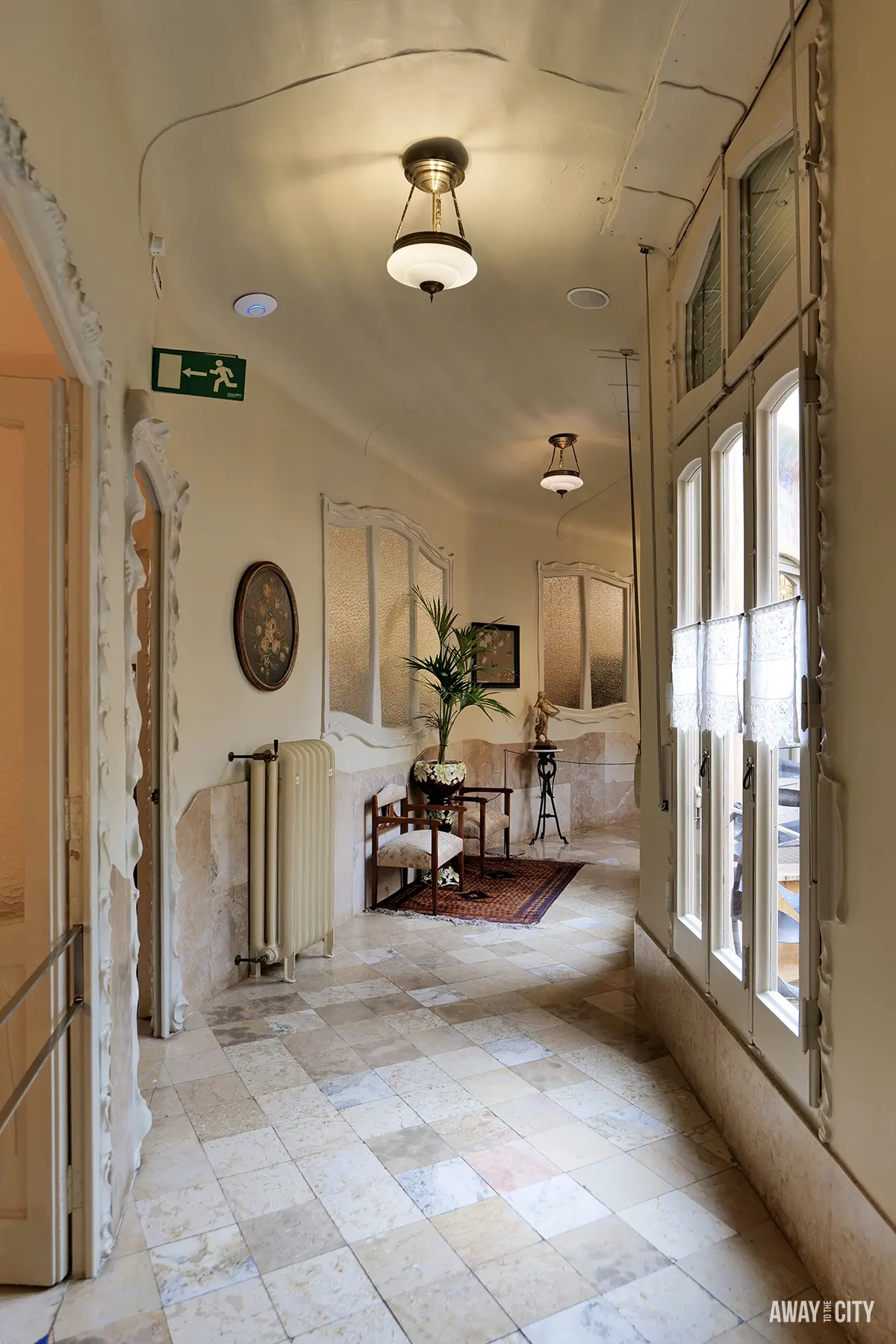The curved hallway inside the recreated early 20th-century apartment at La Pedrera (Casa Milà) in Barcelona.