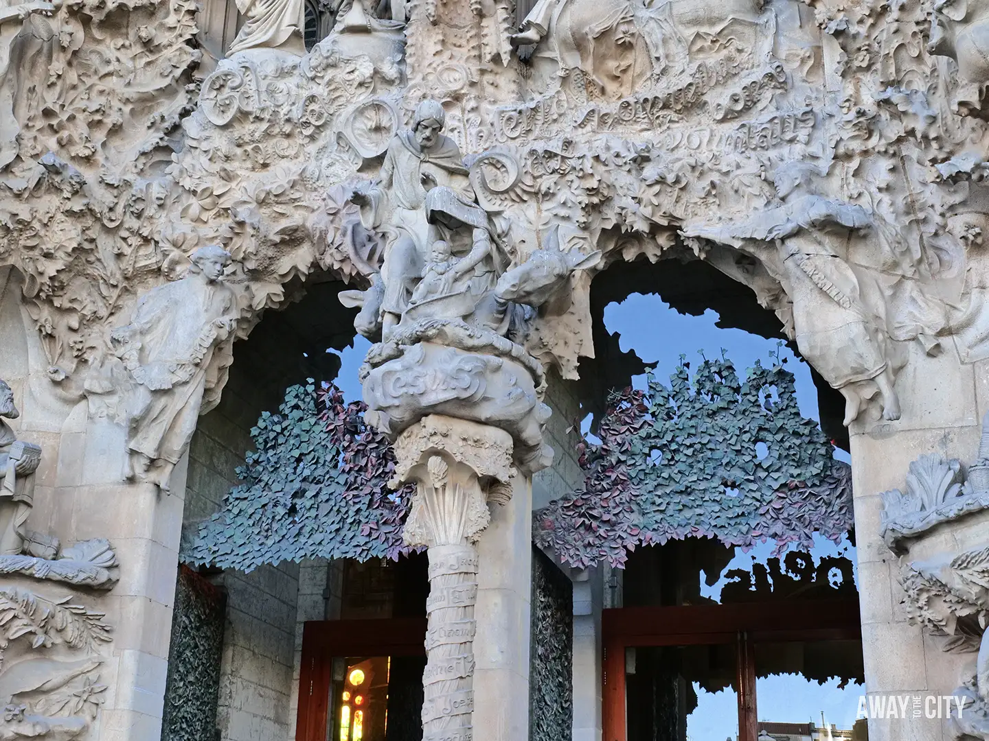 The Sagrada Família's Nativity Façade shows its intricate spires and sculptural detail under construction against a clear blue sky. A close-up of the Nativity Façade entrance, showing a sculpture of the Holy Family surrounded by highly textured stone.