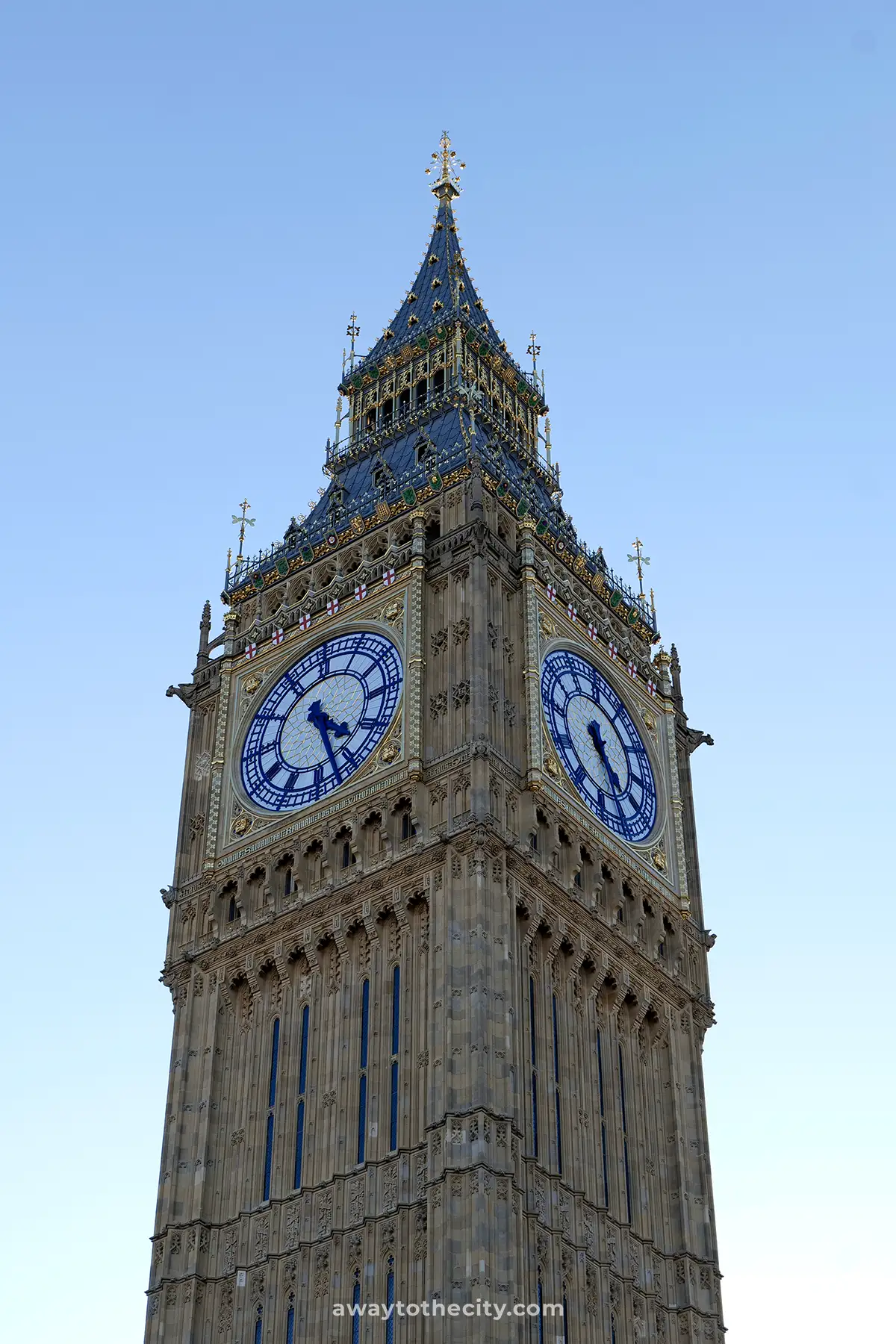 A close-up shows the iconic clock face and intricate details of Big Ben against a clear sky.