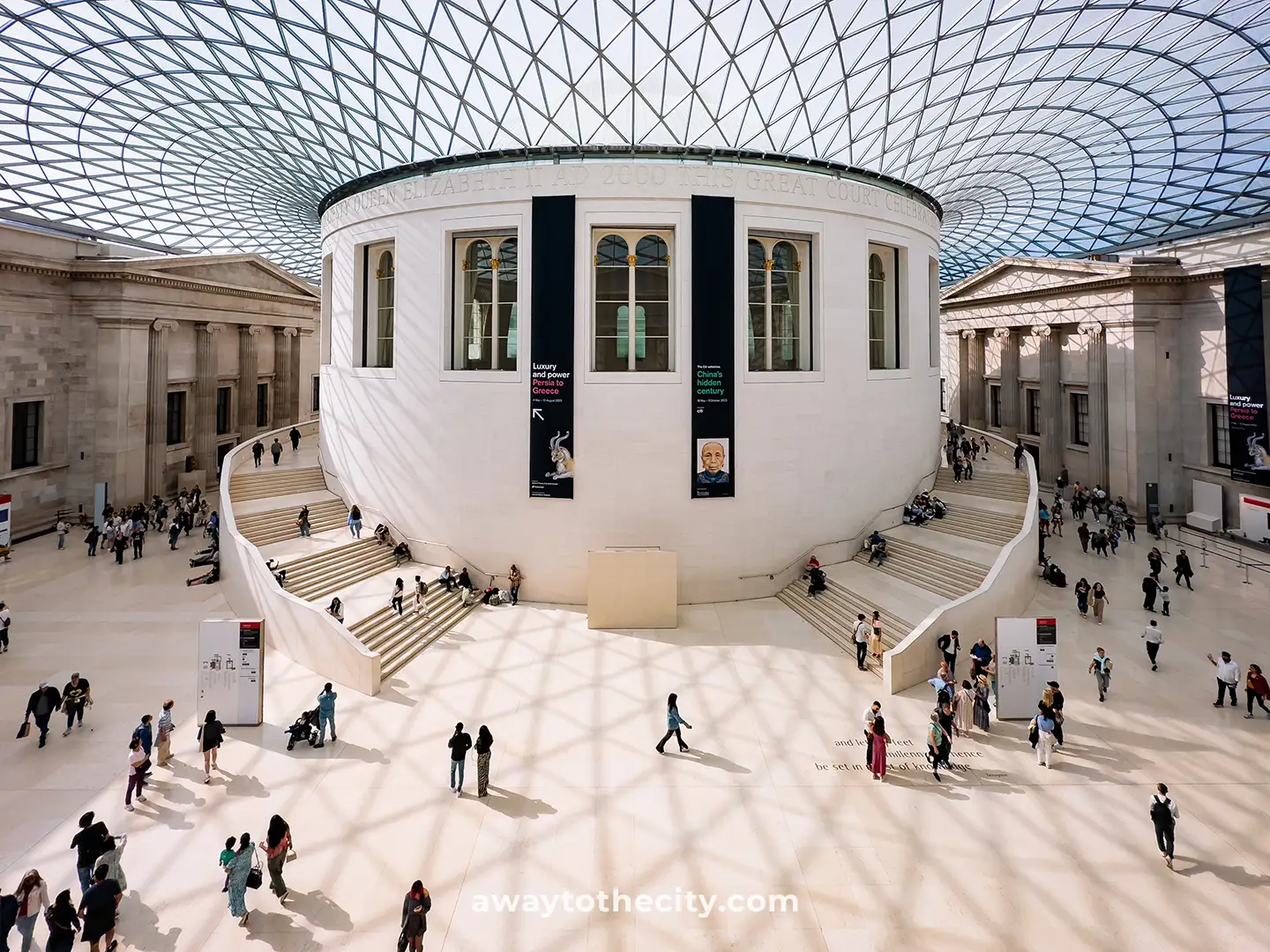 The British Museum's Great Court is filled with natural light, people, and a round building in the centre.