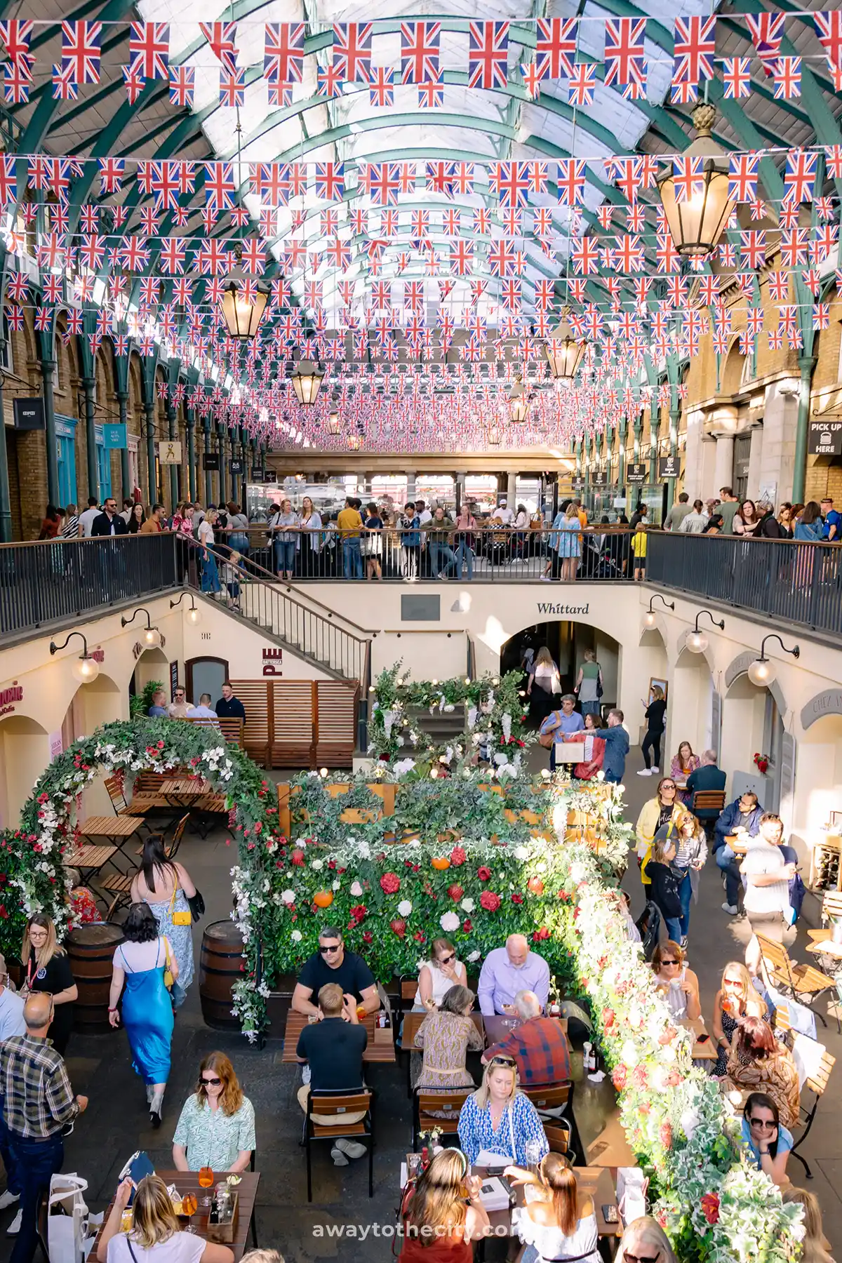 The interior of London's famous Covent Garden, a lively marketplace filled with shops and eateries.