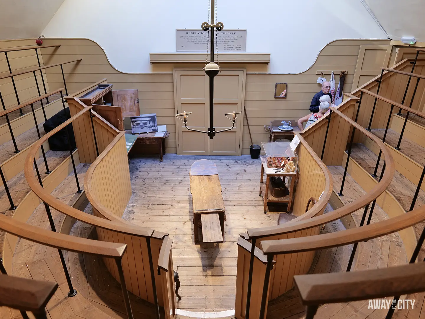 A historical view of the tiered wooden operating theatre at the Old Operating Theatre Museum in London, one of the most unusual things to do in London.