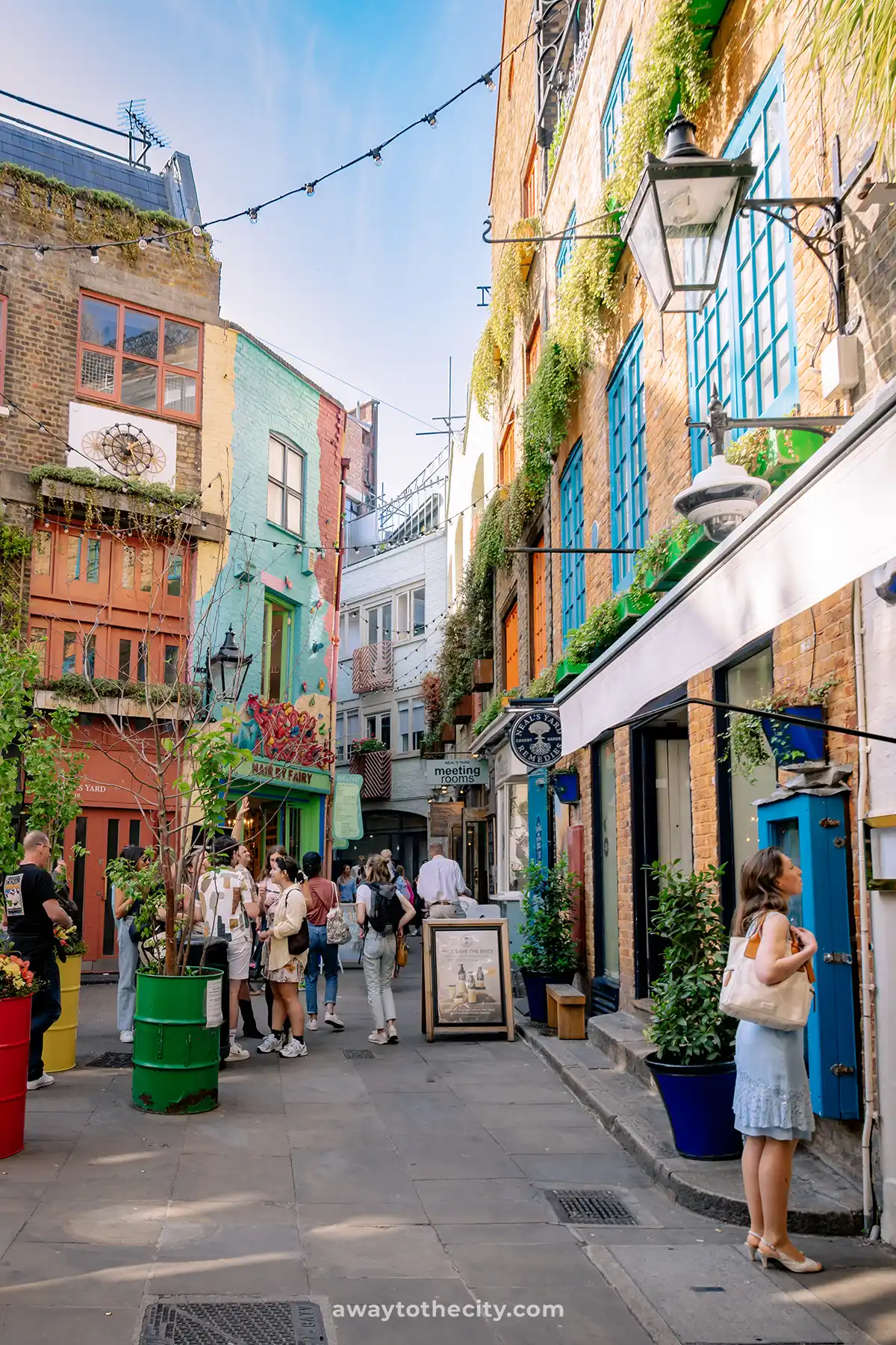 A glimpse of Neal's Yard in Seven Dials, London, known for its picturesque courtyard and colourful buildings.