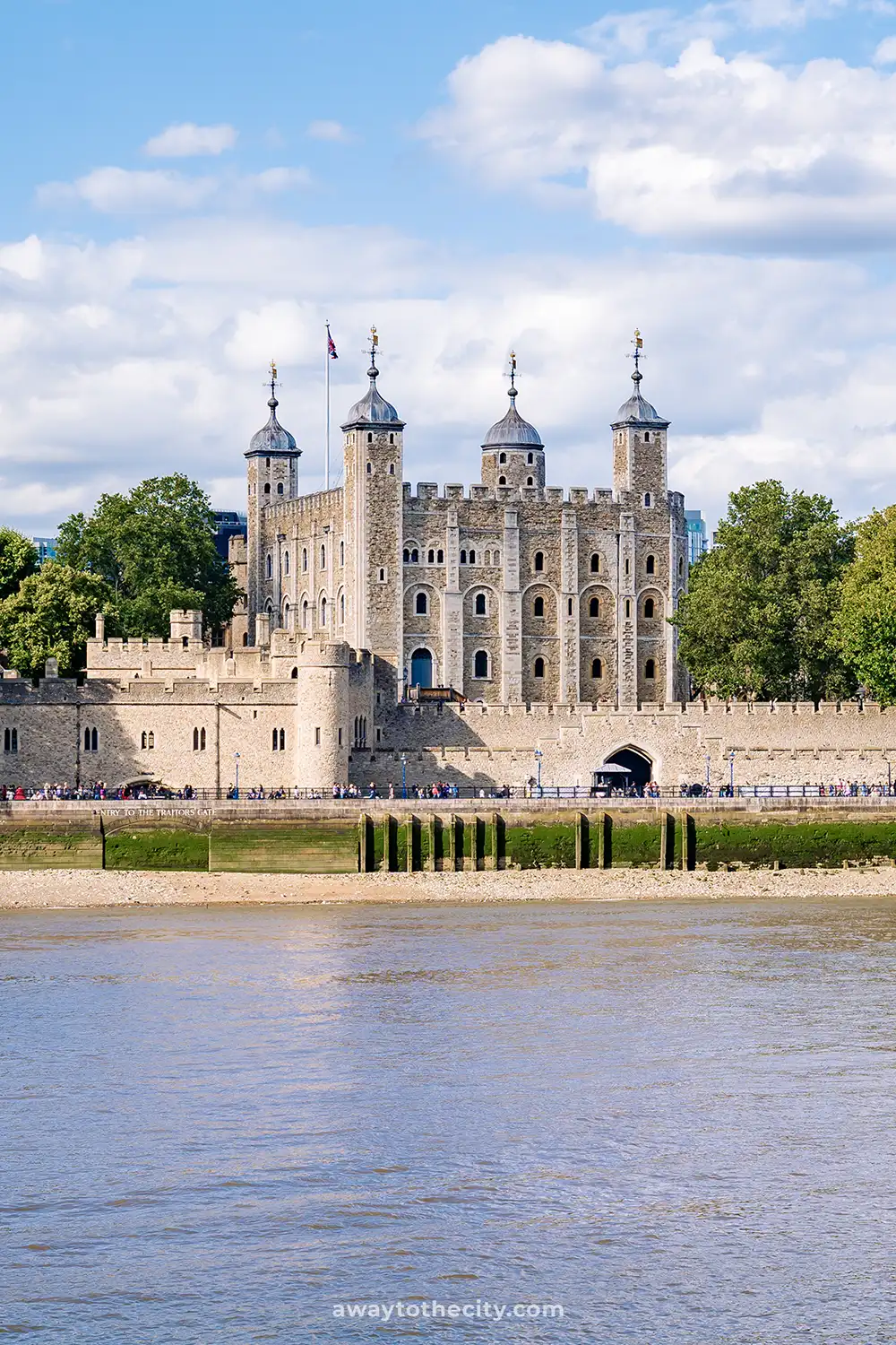 A view from the river of the historic Tower of London, a medieval castle and fortress on the banks of the River Thames.